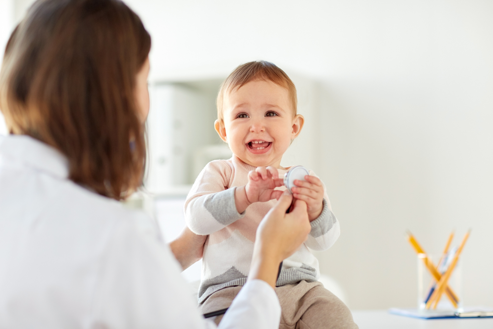 Pediatrician with Baby at Clinic